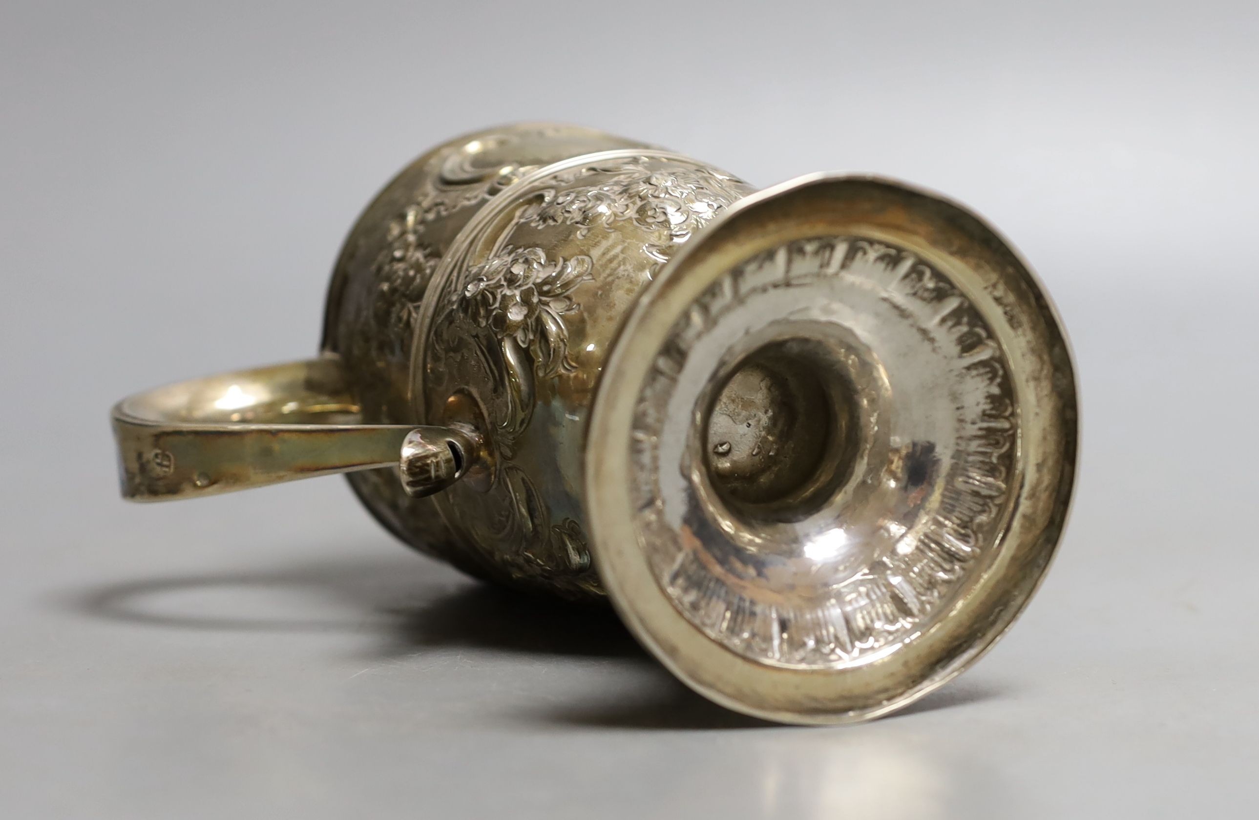 A George III provincial silver two handled pedestal cup, with later embossed decoration, Langlands & Robertson Newcastle, 1794, height 14.7cm, 10.5oz.